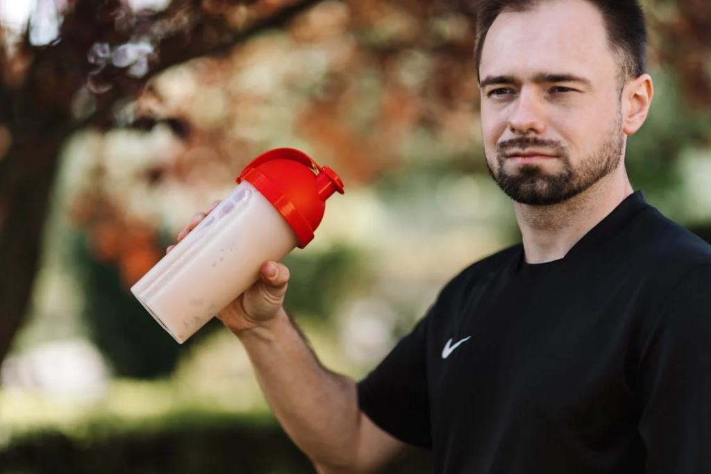 man with protein shake